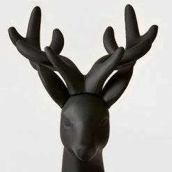 Cheap 😍 12" Plastic Sitting Deer Decorative Figurine Black - Wondershop™ 🔔